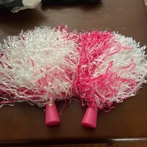Pink and white cheerleaders pom poms